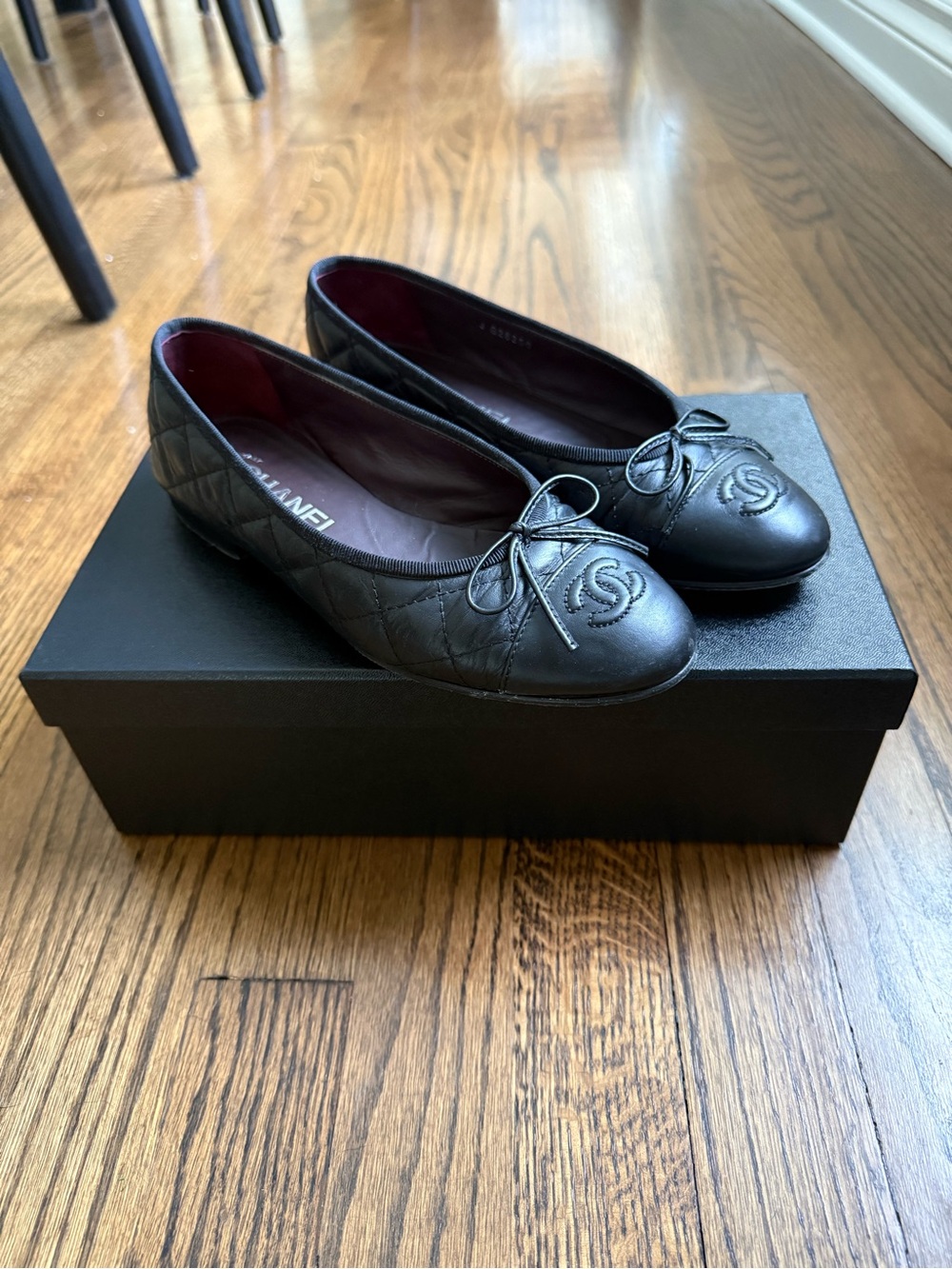 Classic CHANEL Black Quilted Leather Ballet Flats with Bow and CC Medallion